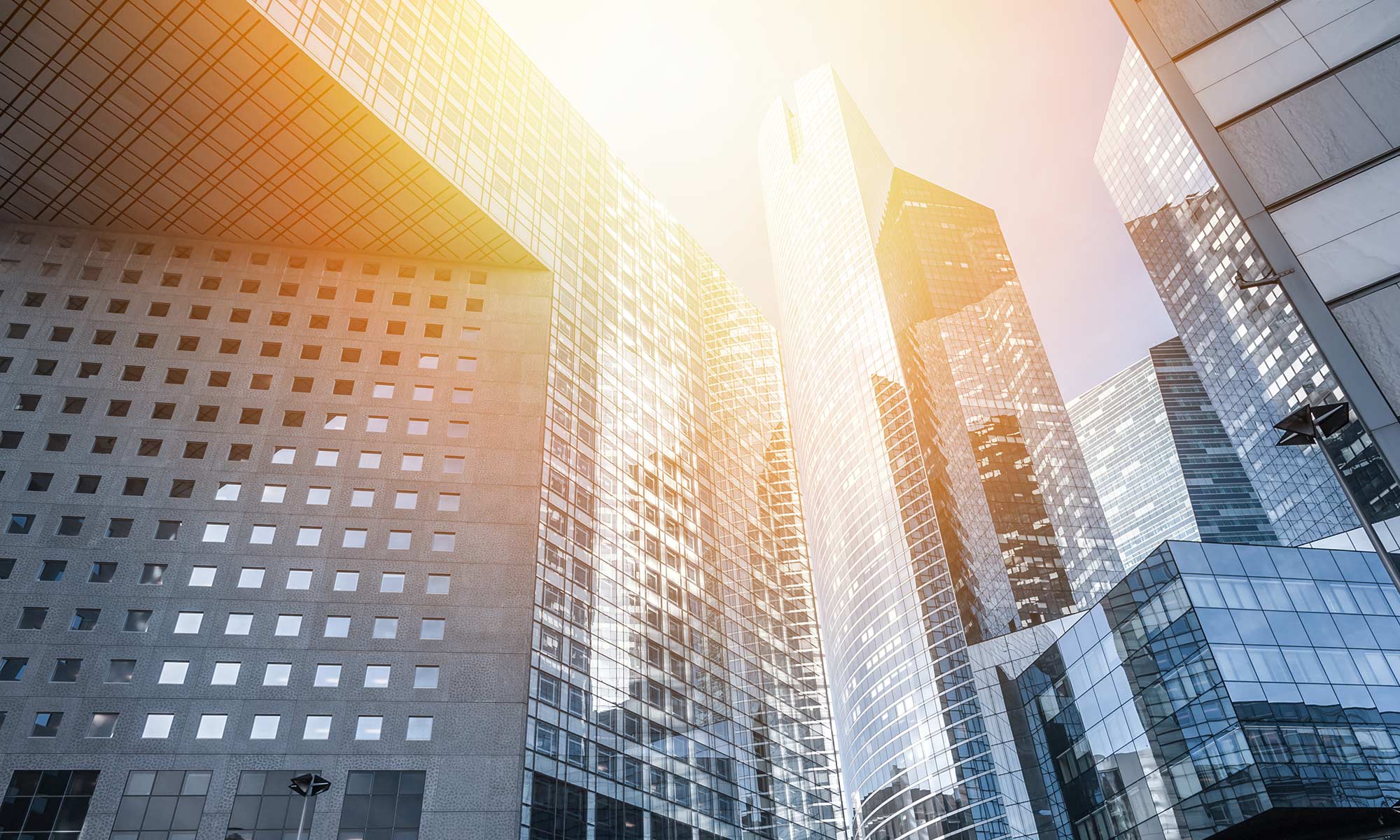 Skyscrapers with sunlight reflecting off windows